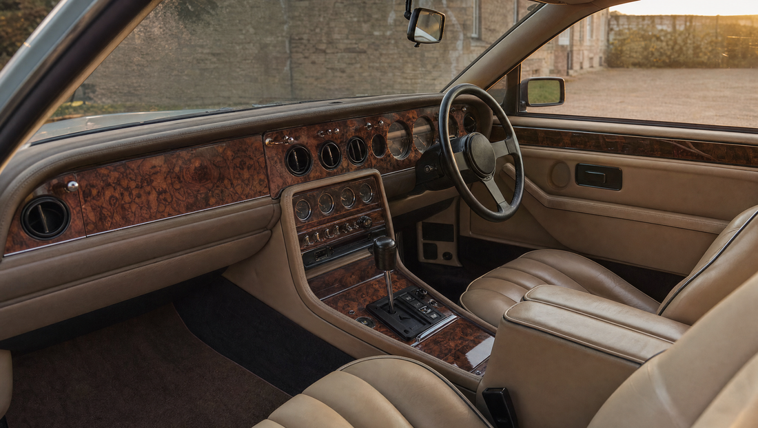 British grand tourer interior with burr walnut veneer and cream leather