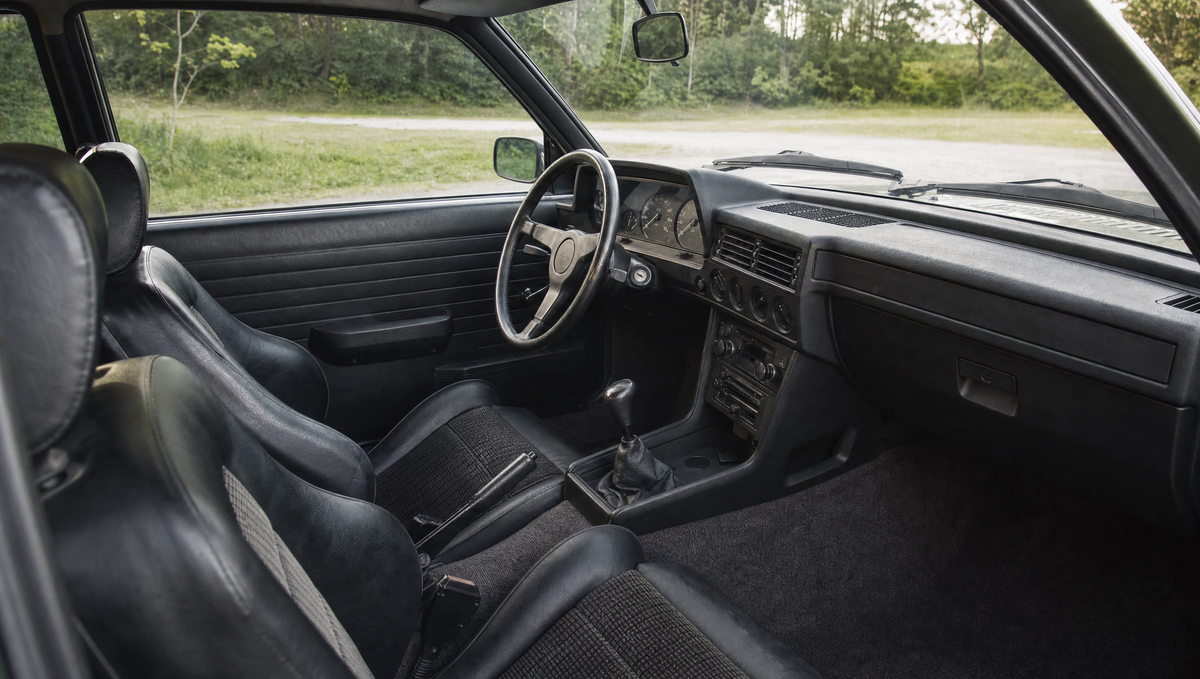 1980s sports saloon interior with black trim and bucket seats