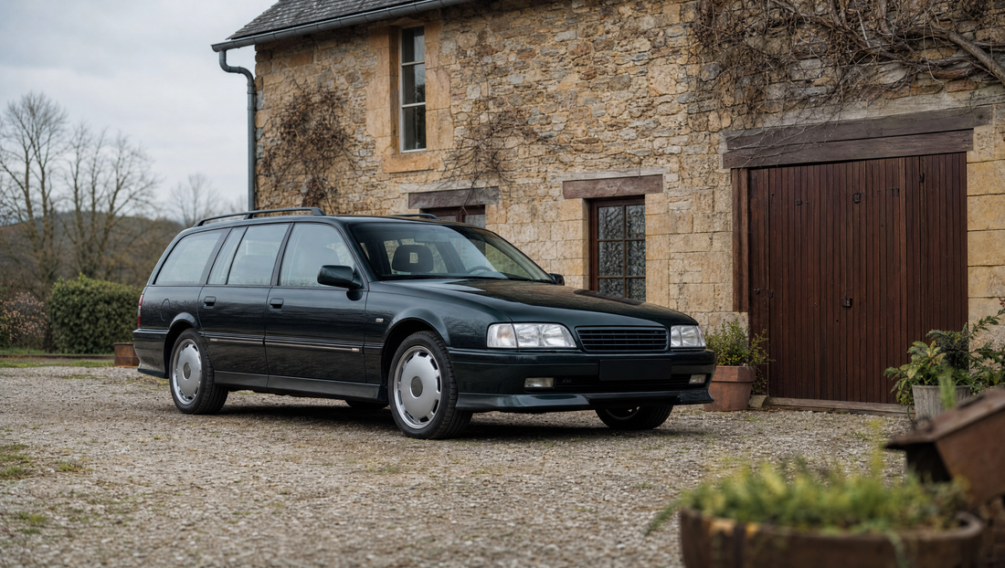Classic 1980s estate car parked outside a stone house