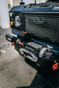 Winch bumper fitted to a Land Rover Defender, shown with a winch installed (winch not included)